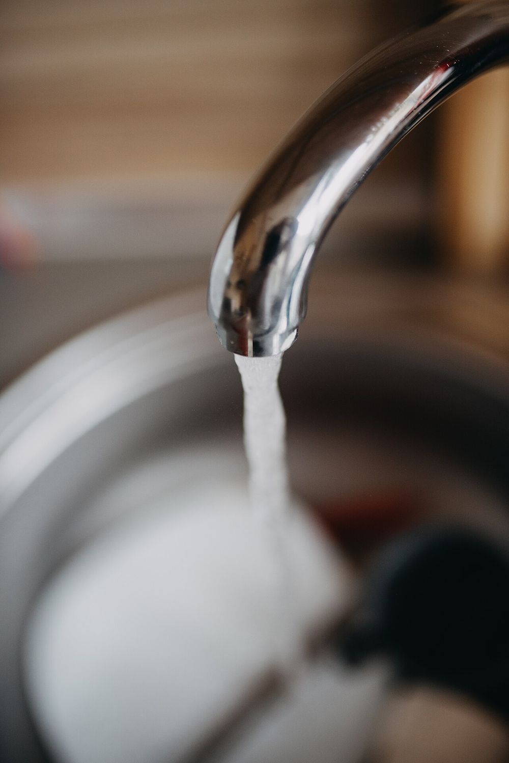 Water running from a chrome kitchen tap
